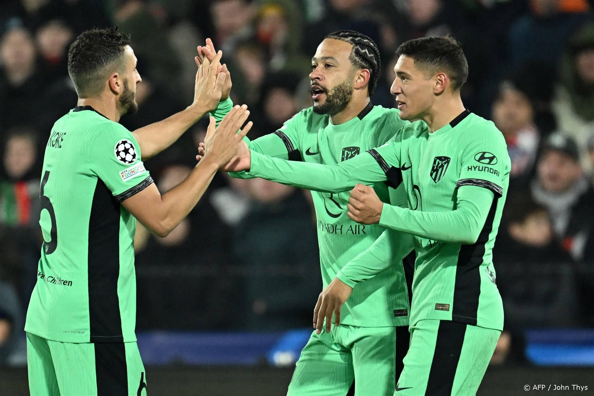 2023-11-28 22:48:01 Atletico Madrid's Spanish midfielder #06 Koke (L), Atletico Madrid's Dutch forward #09 Memphis Depay (C) and Atletico Madrid's Argentine defender #16 Nahuel Molina celebrate Feyenoord's second own goal during the UEFA Champions League Group E football match between Feyenoord and Atletico Madrid at the De Kuip Stadium in Rotterdam on November 28, 2023. 
JOHN THYS / AFP